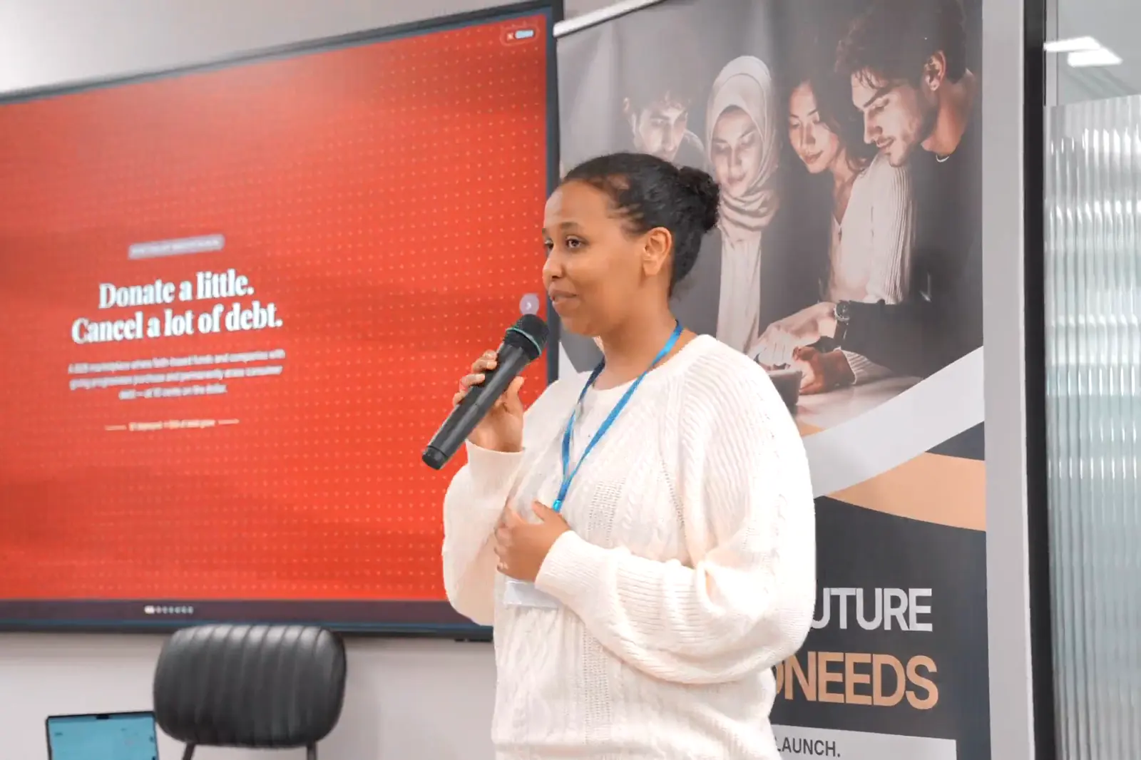 A finalist presenting her debt relief product